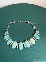 Full view of necklace showing cabochons, spacers, and clasp