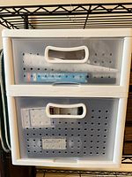 Front view of Sterilite two-drawer unit showing drawers and visible contents