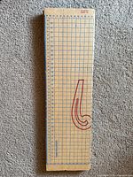 Full length view of folded cardboard dress board showing overall design