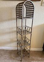 Full view of four-tier arched metal shelf