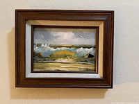 front view of framed seascape painting