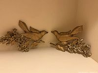 Pair of Syroco bird wall plaques on branches