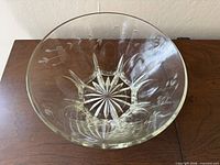 Top view of clear cut lead crystal bowl showing floral and starburst patterns
