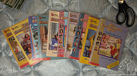 Front covers of the ten Baby-Sitters Club books spread out