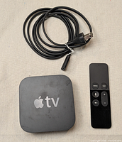 Apple TV unit, power cord, remote
