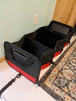 Organizer fully extended showing four compartments and side straps