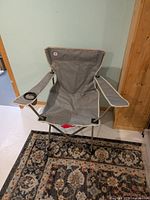 Full view of grey folding camping chair