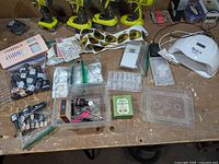 Overall lot showing UV lamp, gel bottles, forms, tips, stickers, tools