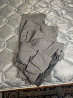Plaid suit pieces folded showing fabric and lining