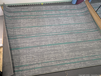 Full view of rug laid out showing colour and pattern