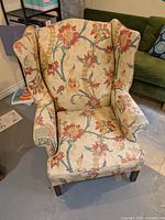 Full view of floral wingback chair
