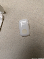 Front view of Upright Go 2 sensor showing lightning logo and Upright branding