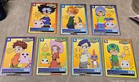 All seven Digimon Introductory Series 1 cards laid out
