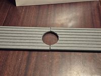 Two-piece graphite stone faucet mat with central circular cut-out