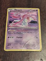 Front of Mesprit holo card showing artwork, border wear, creases