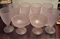 Six goblets and two dessert cups arranged facing front