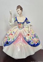 Front view of Royal Doulton Christine HN 2792 figurine showing dress detail and pose