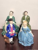 Group view of all four Royal Doulton Colonial Williamsburg figurines