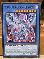 Front of Blue-Eyes Chaos Dragon card showing artwork, stats and card code