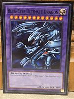 Front of Blue-Eyes Ultimate Dragon card in sleeve