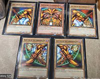 Group image of all five Exodia cards in sleeves