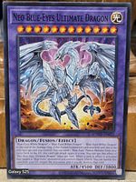 Front of Neo Blue-Eyes Ultimate Dragon card showing title, artwork, stats, set code