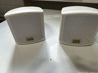 Front view of both Acoustic Audio AA321 speakers with grilles