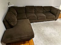 Full view of sectional showing chaise on left and seat/back cushions
