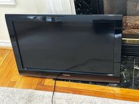Front view of Toshiba flat-panel TV showing screen and bezel