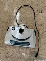 Top view of vacuum power nozzle with cord visible