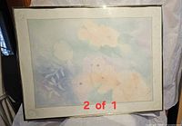 Front view of first framed floral poster