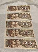 Five uncirculated 1 Jiao notes laid out in sequence