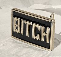 Front view showing full buckle, black enamel and silver lettering