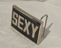 Front angled view showing SEXY lettering and rectangular shape