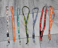 Overview of all seven lanyards laid out on floor