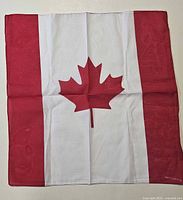 Square cotton bandana with red maple leaf flag design displayed flat