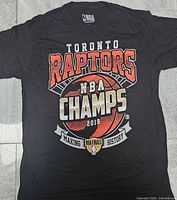 Full view of front of T-shirt showing graphic and size
