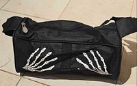 Side view showing skeleton hand prints and zipper