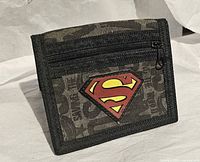 Front view of Superman wallet showing S logo patch and zip pocket