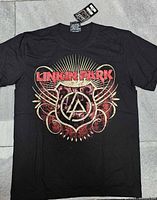 Full front view of black Linkin Park T-shirt with tag showing size and condition