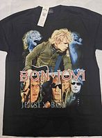 Front view of black Bon Jovi Jersey Boy graphic T-shirt with tag attached