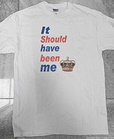 Front view of white T-shirt showing full text graphic and crown