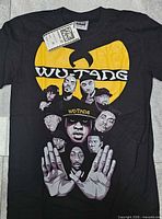 Full view of black Wu-Tang Clan T-shirt with attached tag