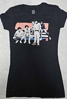 Front view of black women’s One Direction graphic T-shirt showing design, size and overall condition