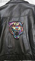 Patch on black leather jacket showing overall design