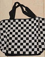 Front view of black and white checkerboard tote