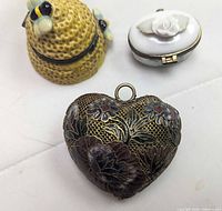 Group view of beehive pill box, rose pill box, cloisonné heart