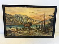 Full view of framed painting showing entire artwork and frame