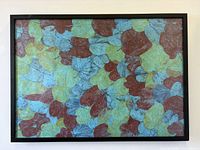 Front view of framed leaf impression artwork showing overall design