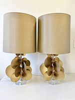 Front view of both bronzed disc lucite lamps with shades